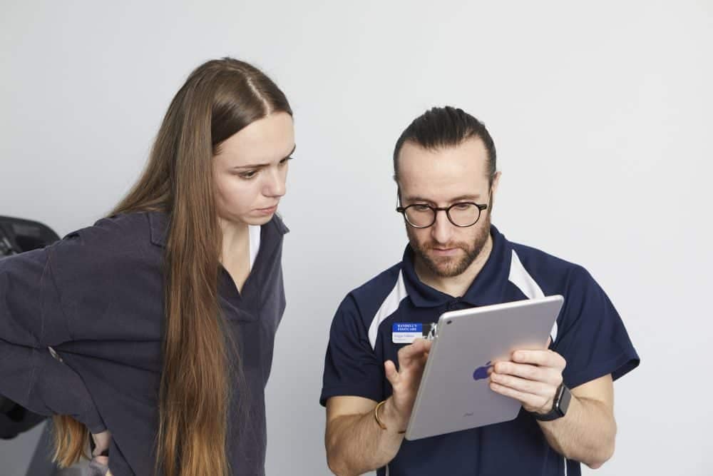 Podiatrist explaining to patient with Ipad