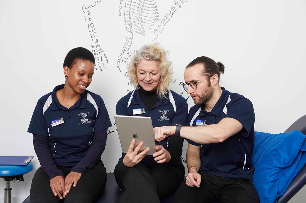 3 podiatrist chatting together
