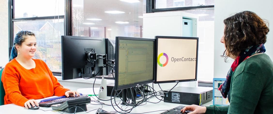 Two coworkers collaborating at OpenContact office