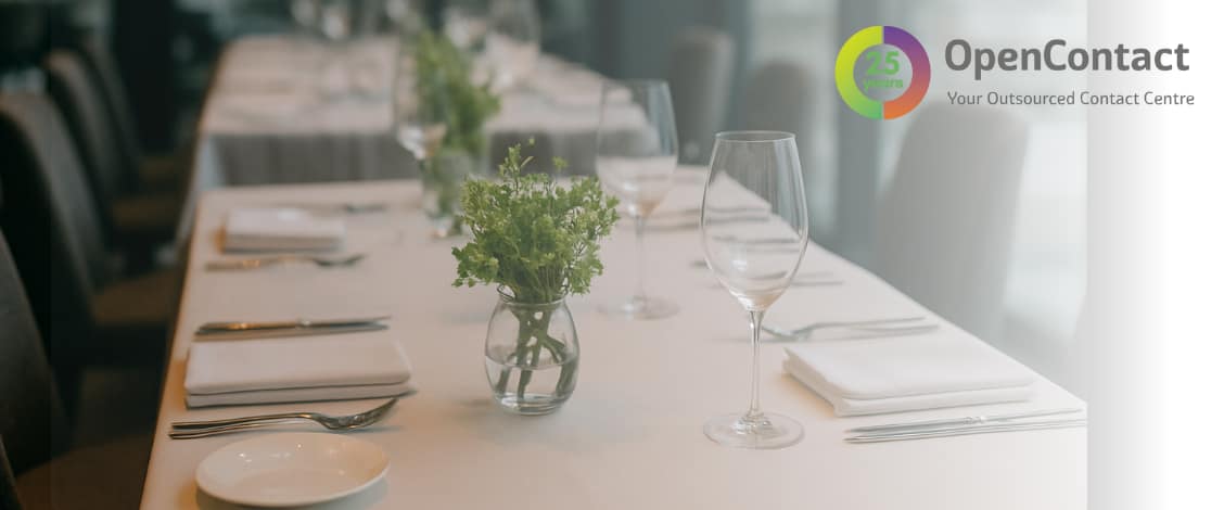 Elegant table setting with OpenContact logo