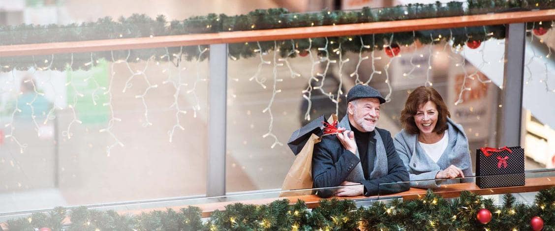Happy couple shopping during Christmas season