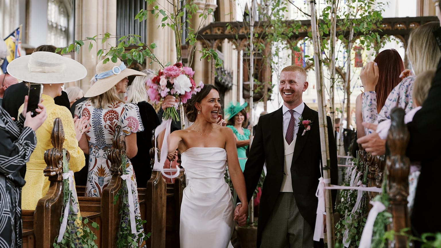 Newlyweds celebrating at their wedding ceremony.