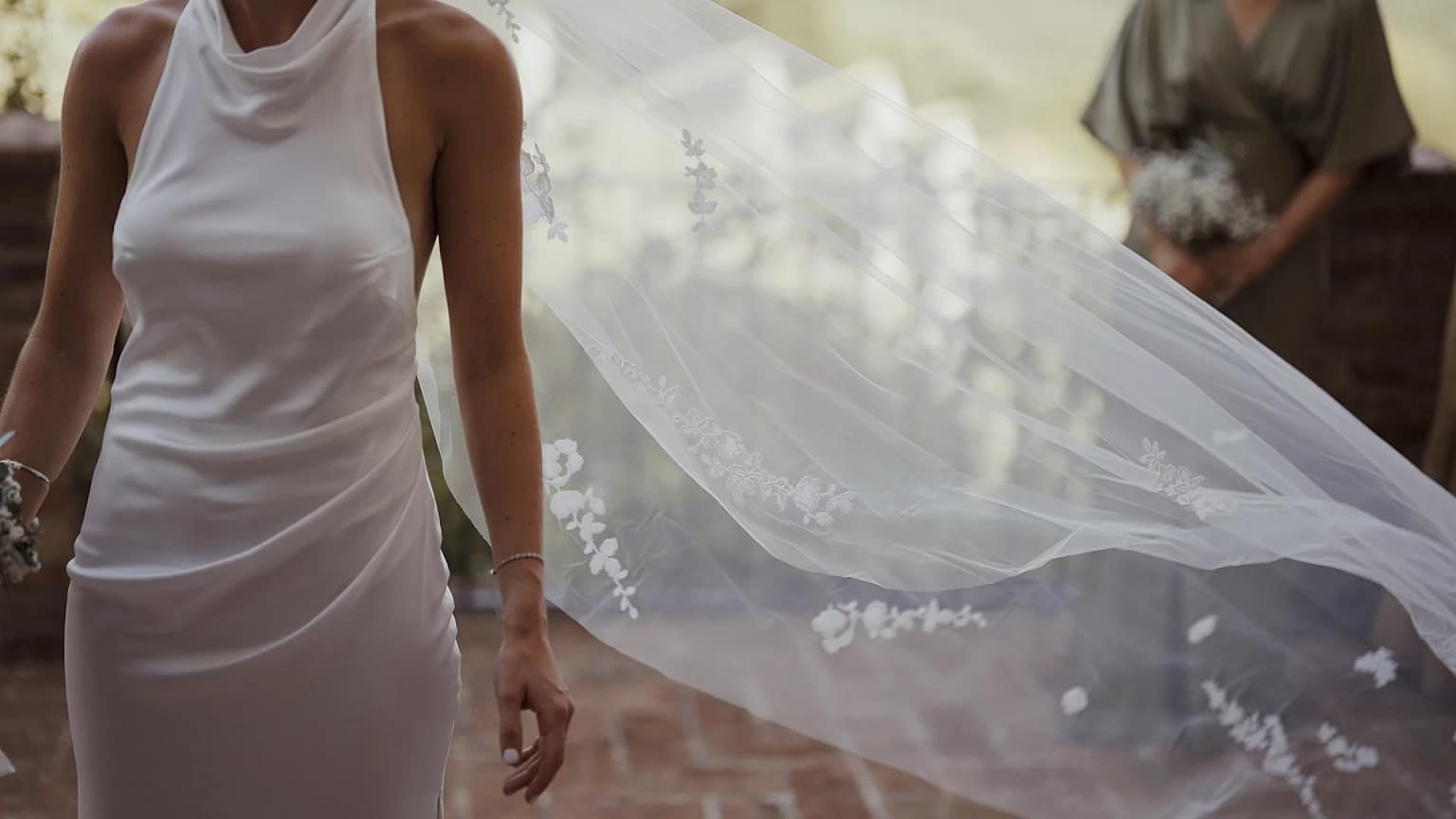 Bride in white dress with flowing veil