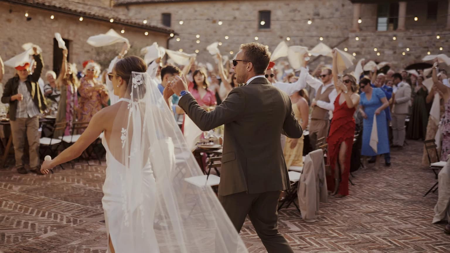 Bride and groom dancing at outdoor wedding celebration