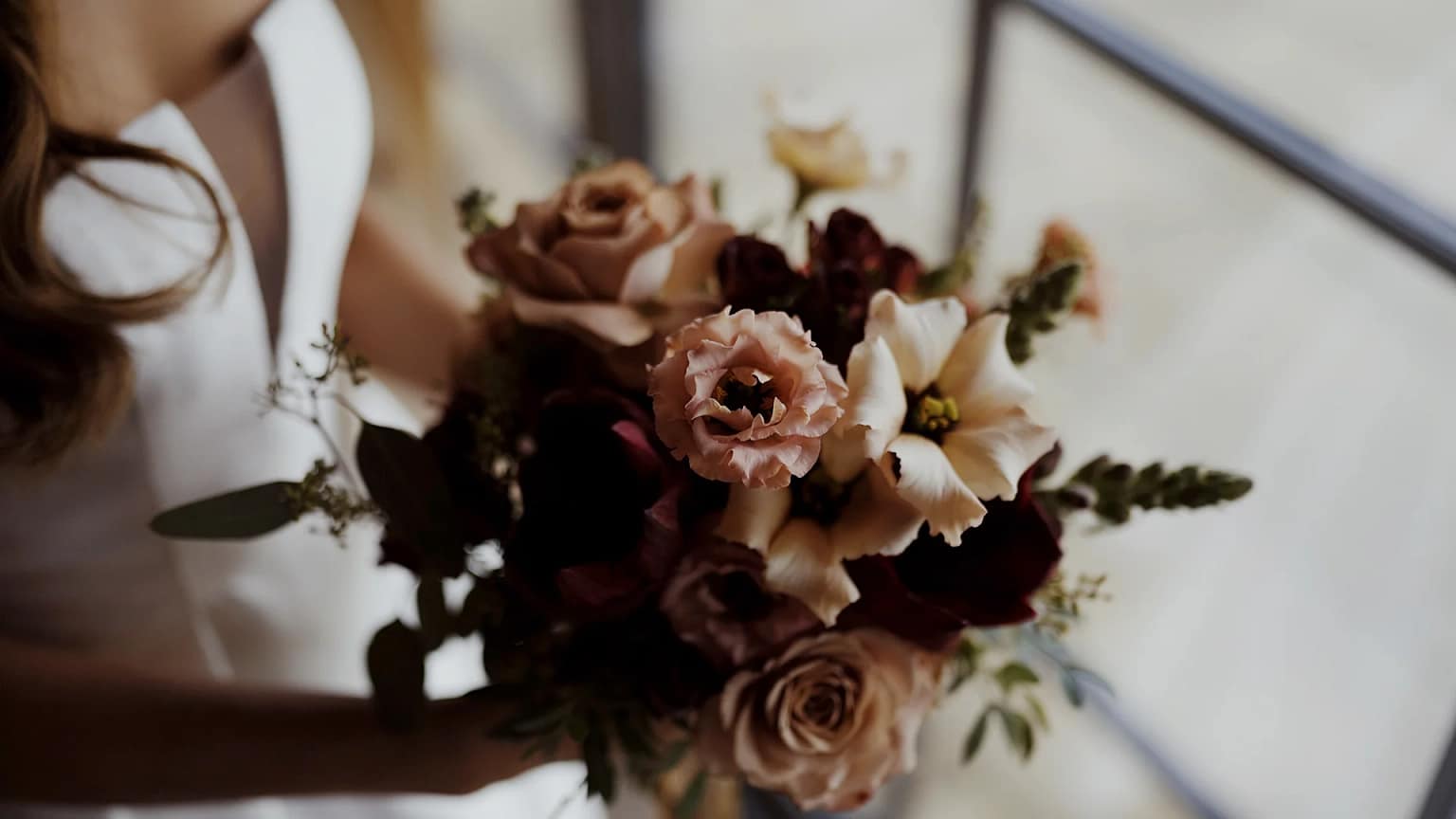 Bride holding elegant flower bouquet