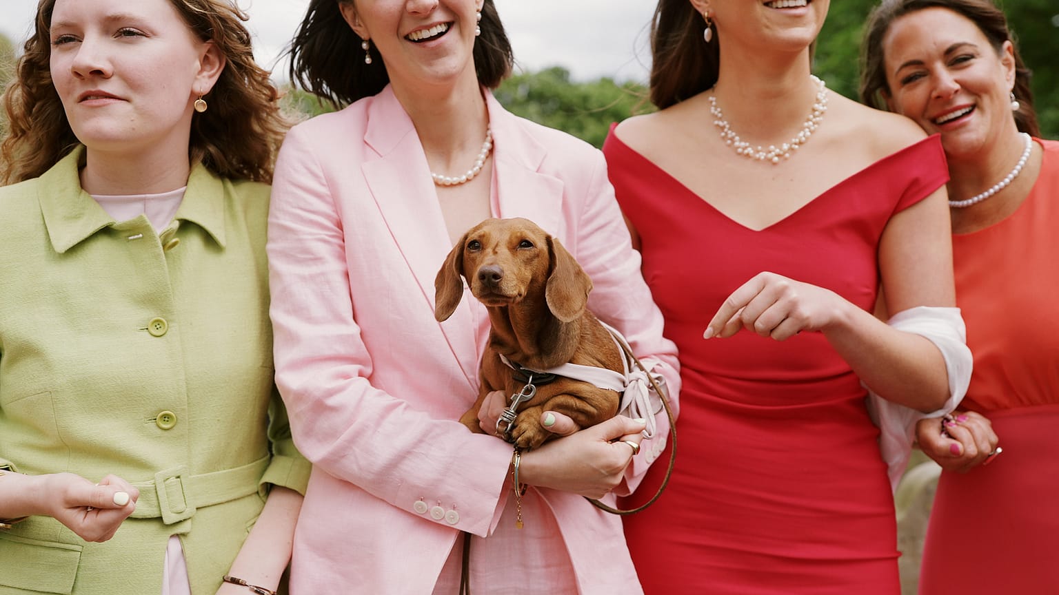 Women with dachshund at outdoor event