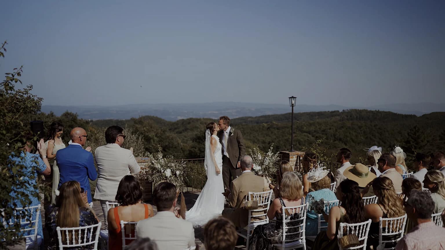 Outdoor wedding ceremony with mountain backdrop