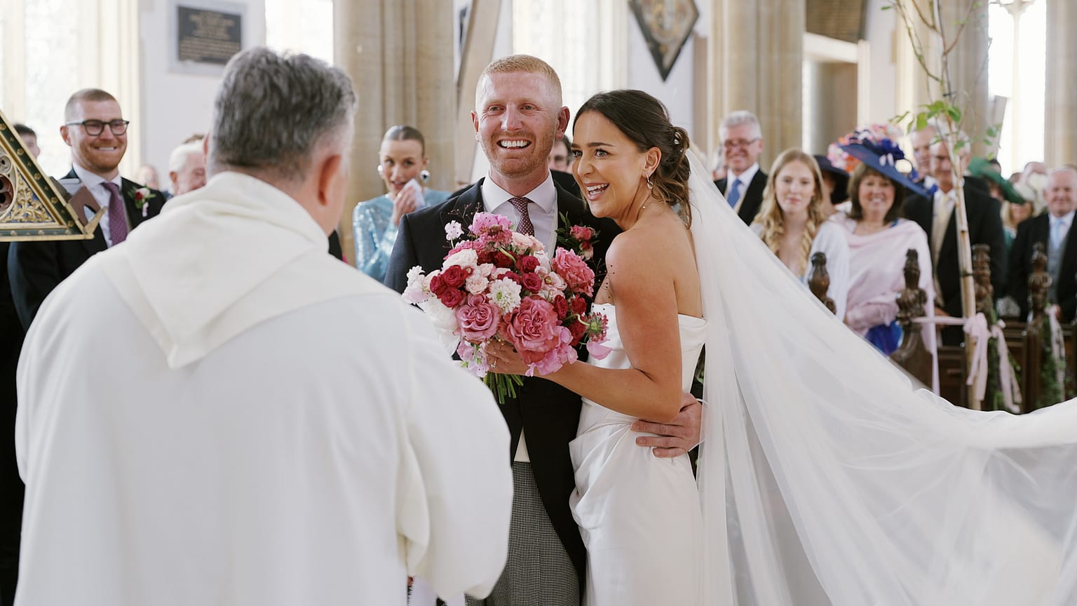 Bride and groom smiling during wedding ceremony