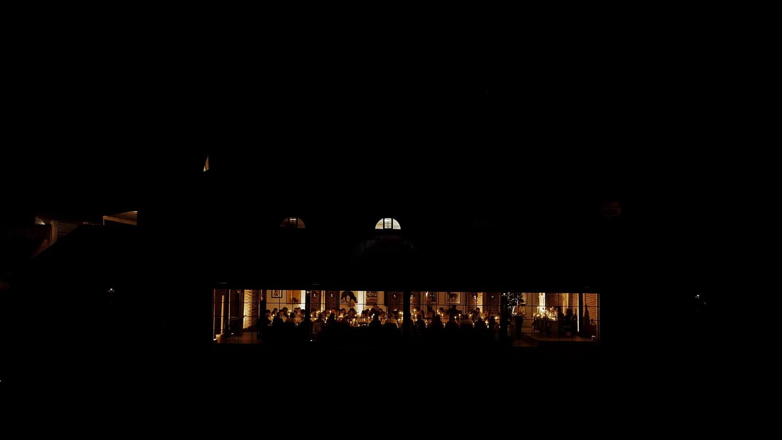 Candlelit dinner gathering at night