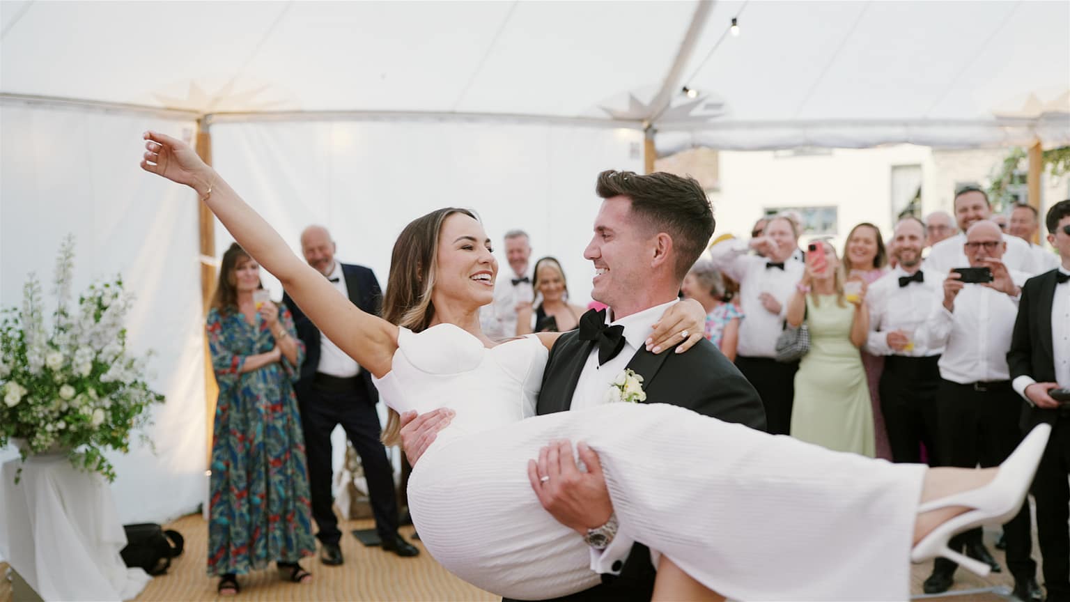 Bride and groom celebrating their wedding day joyfully.