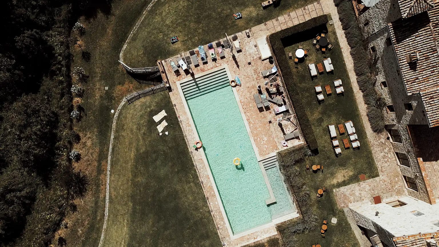 Aerial view of outdoor pool and seating area.