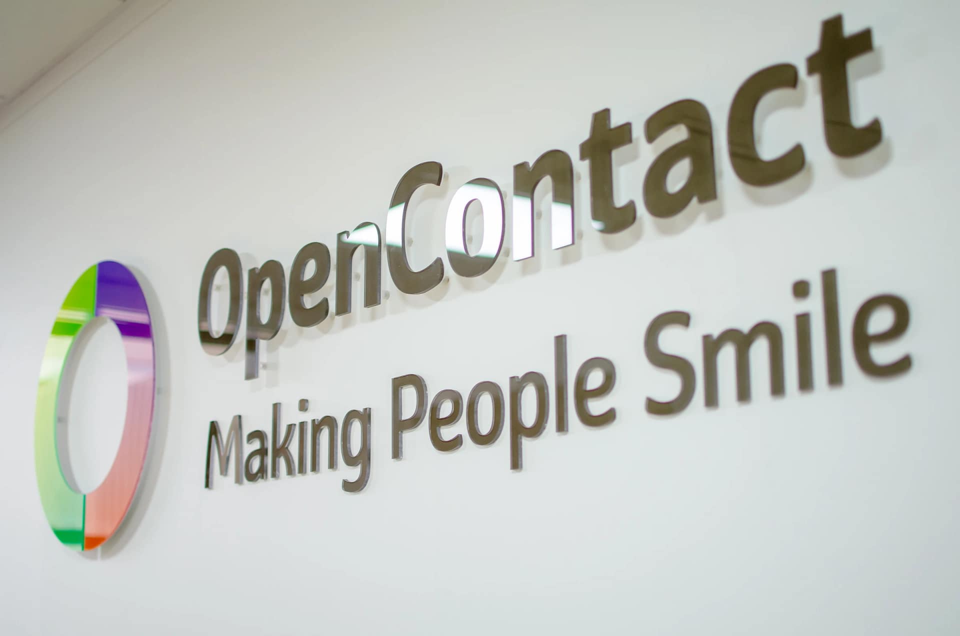 OpenContact company logo on office wall