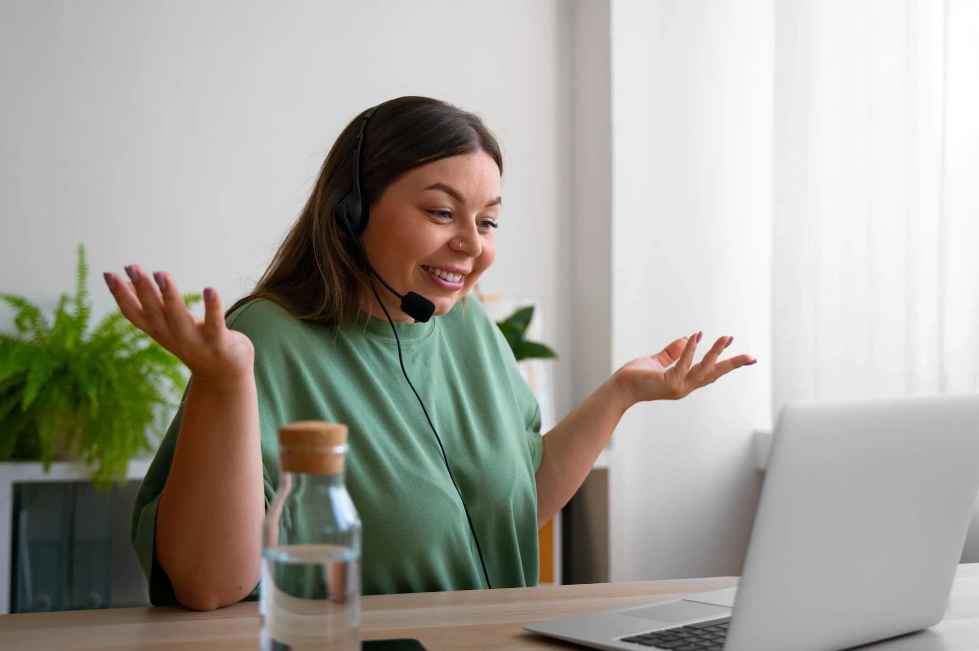 Woman smiling during video call with headset