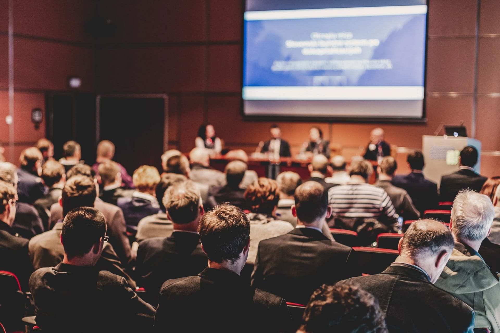 Audience attending business conference presentation