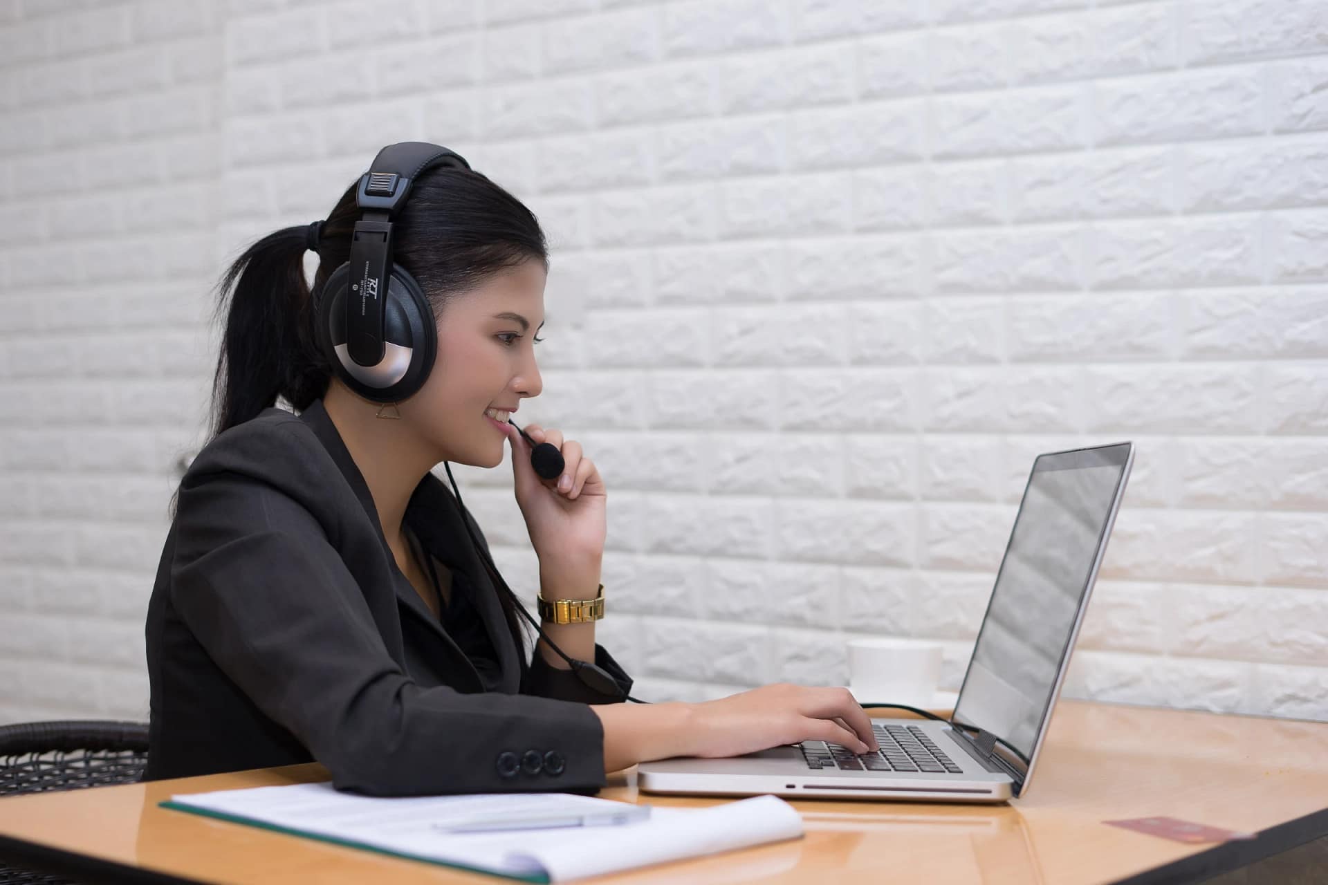Customer service agent working on laptop