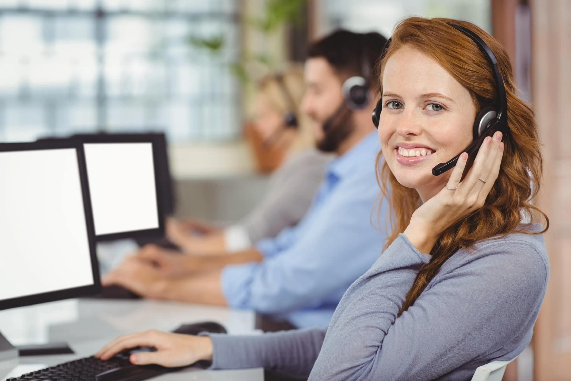 Smiling customer support agent with headset