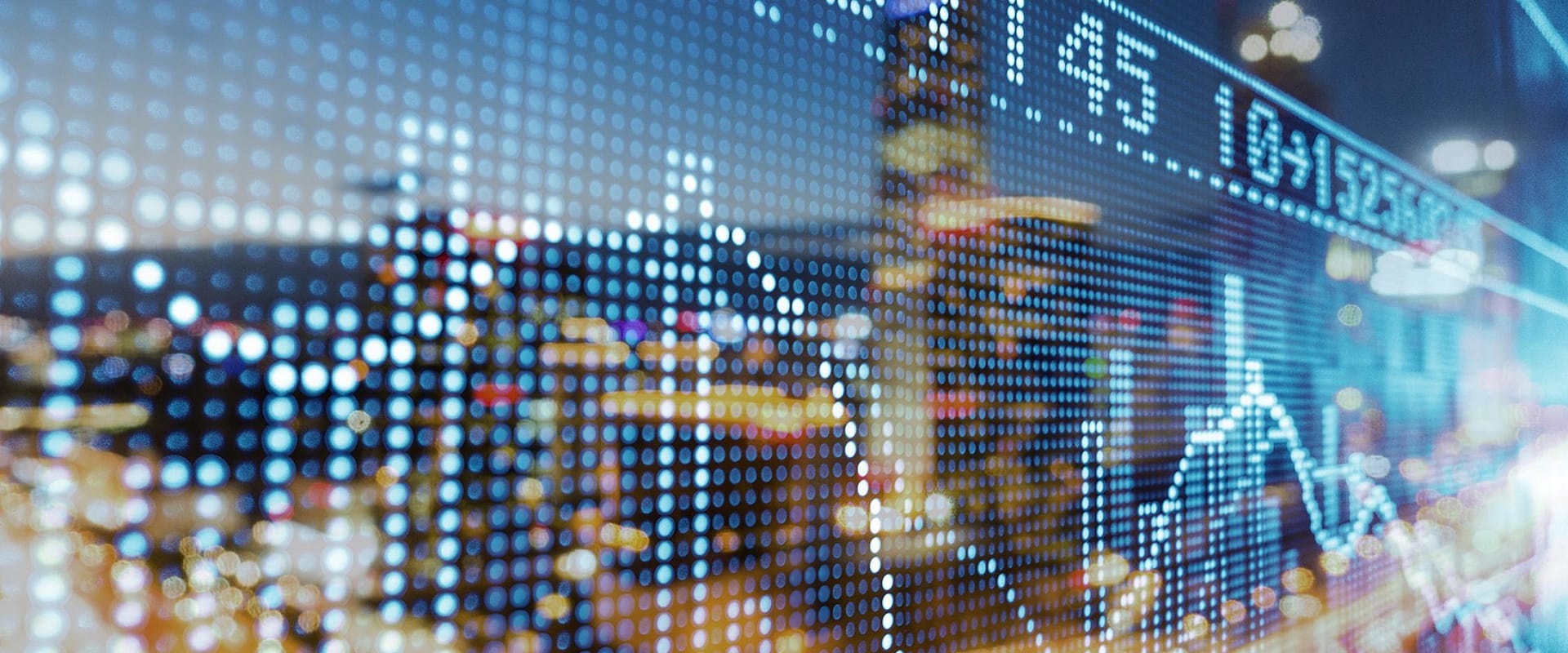 Digital stock market data on city lights background