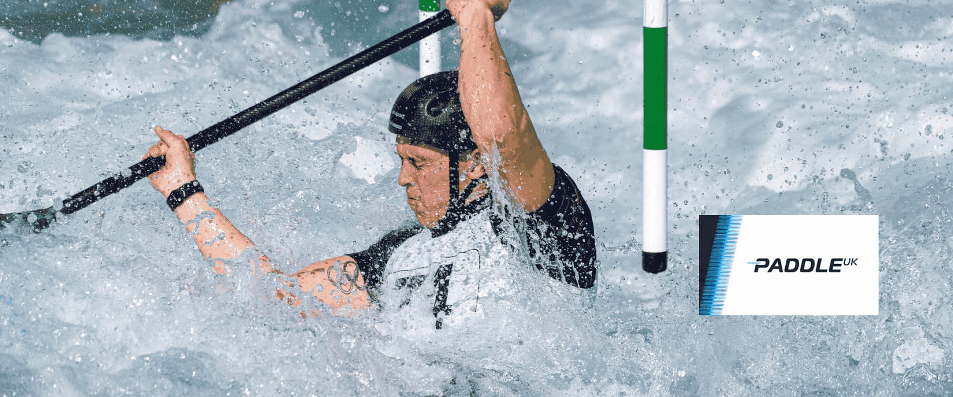 Kayaker paddling through whitewater rapids