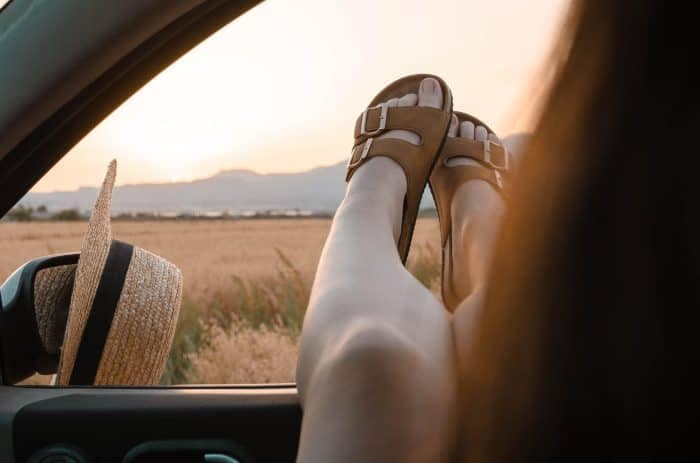 feet out of car window