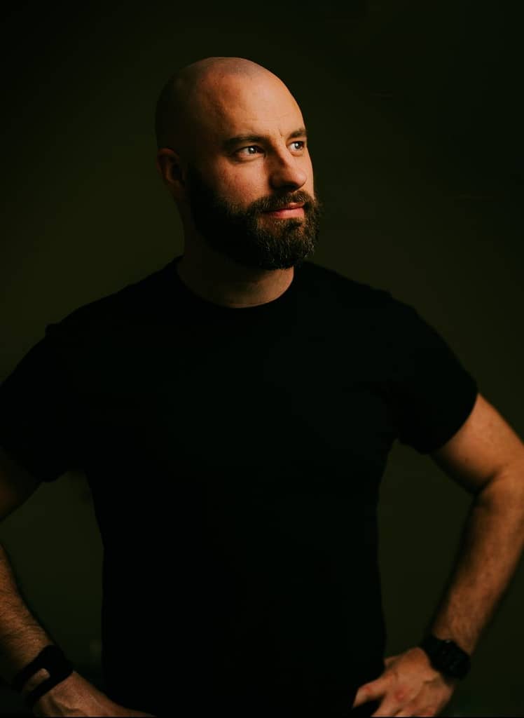 Bearded man looking confidently into distance