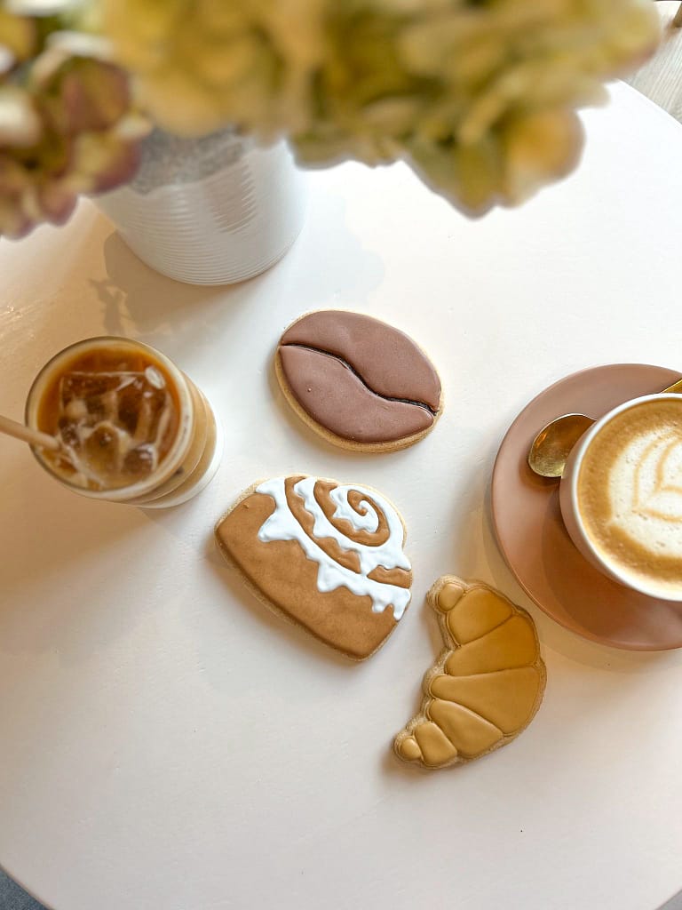Coffee with cookies on round white table