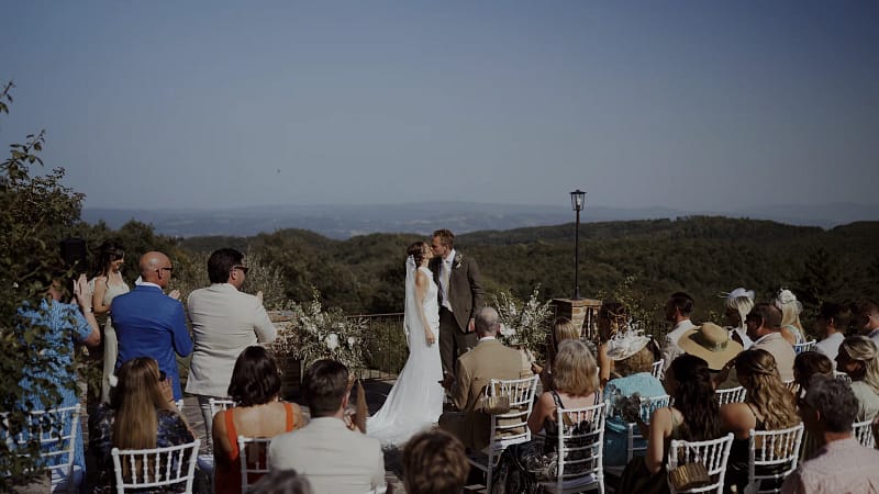 Outdoor wedding ceremony with mountain backdrop