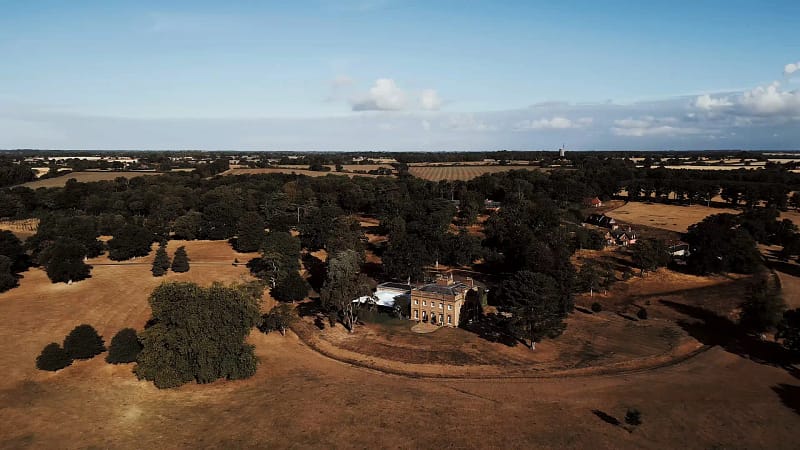 Aerial view of countryside estate with surrounding fields