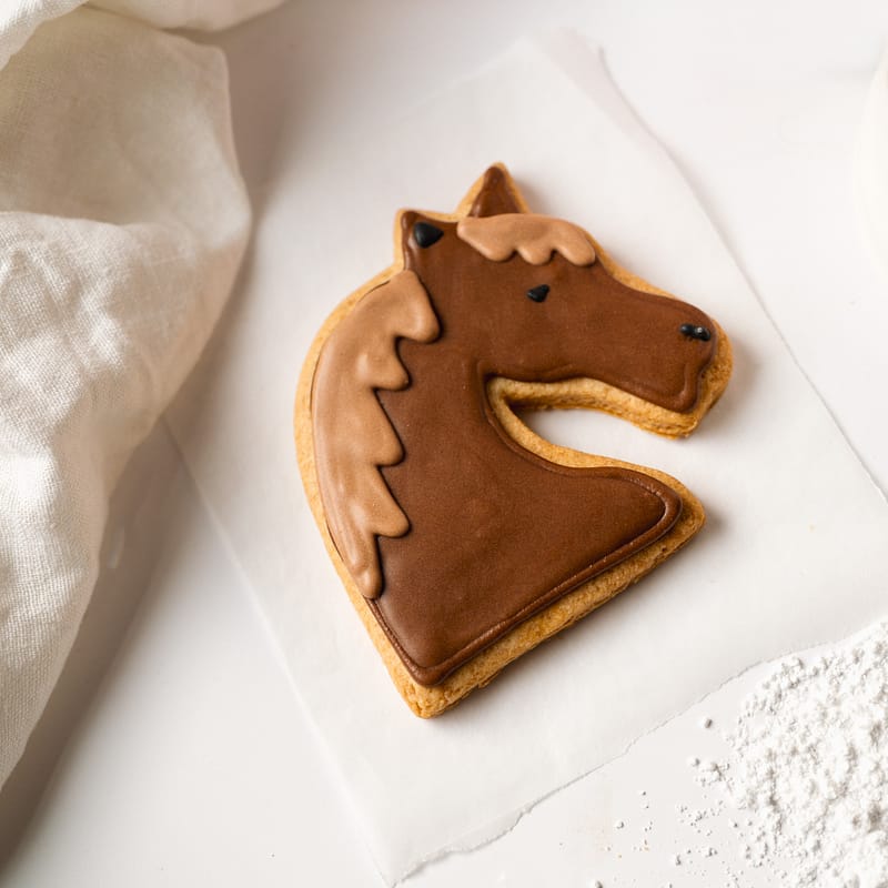 Horse-shaped biscuit with icing decoration.