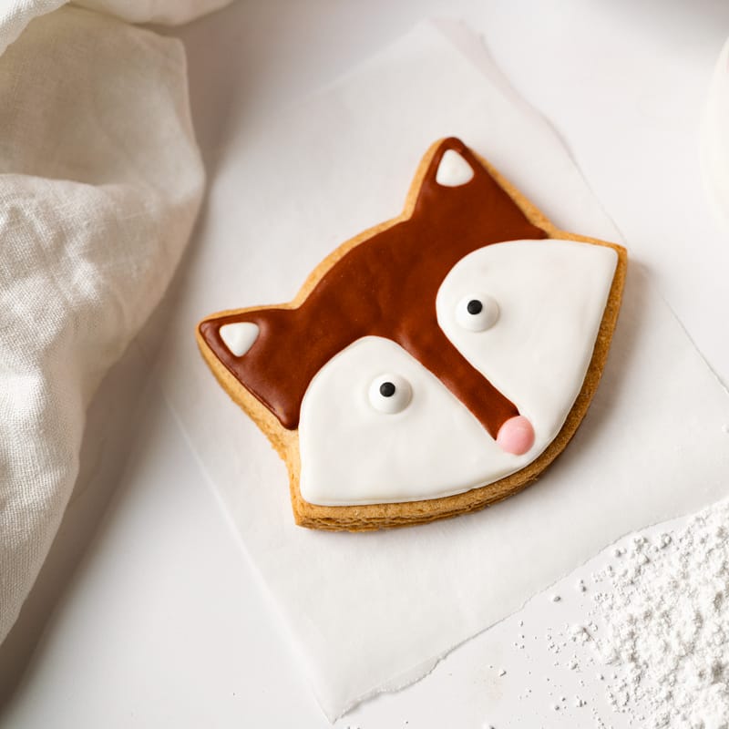 Fox-shaped biscuit with icing detail.